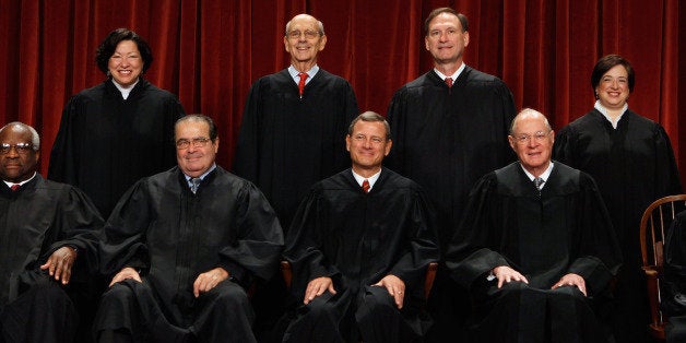 WASHINGTON - OCTOBER 08: U.S. Supreme Court members (first row L-R) Associate Justice Clarence Thomas, Associate Justice Antonin Scalia, Chief Justice John Roberts, Associate Justice Anthony Kennedy, Associate Justice Ruth Bader Ginsburg, (back row L-R) Associate Justice Sonia Sotomayor, Associate Justice Stephen Breyer, Associate Justice Samuel Alito and Associate Justice Elena Kagan pose for photographs in the East Conference Room at the Supreme Court building October 8, 2010 in Washington, DC. This is the first time in history that three women are simultaneously serving on the court. (Photo by Chip Somodevilla/Getty Images)