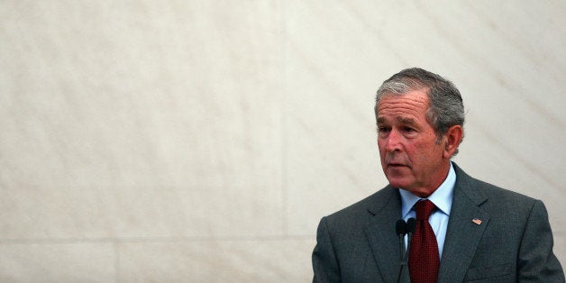 DALLAS, TX - JULY 10: Former U.S. President George W. Bush speaks during a immigration naturalization ceremony held at the George W. Bush Presidential Center on July 10, 2013 in Dallas, Texas. Bush delivered keynote remarks during the naturalization ceremony, where 20 candidates took the oath of allegiance and became American citizens. (Photo by Tom Pennington/Getty Images)