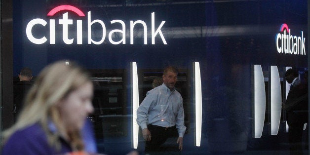 NEW YORK, NY - DECEMBER 05: People walk at a Citibank branch at Citibank headquarters in Manhattan on December 5, 2012 in New York City. Citigroup Inc. today announced it was laying off 11,000 workers, about 4 percent of its workforce, in a move to slash costs. (Photo by Mario Tama/Getty Images)