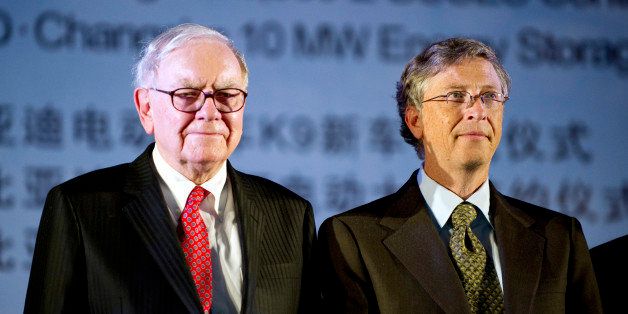 Warren Buffett, chairman of Berkshire Hathaway Inc., left, stands with Bill Gates, of the Bill and Melinda Gates Foundation, prior to the BYD news conference in Changsha, Hunan province, China, on Thursday, Sept. 30, 2010. Buffett said he expects 'large' opportunities in China, making the world's fastest growing major economy a 'logical' place to invest. Photographer: Stefen Chow/Bloomberg via Getty Images