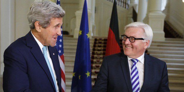 US Secretary of State John Kerry (L) and German Foreign Minister Frank-Walter Steinmeier (R) shake hands as they arrive to address the media after a bilateral meeting during talks between the foreign ministers of the six powers negotiating with Tehran on its nuclear program, in Vienna, on July 13, 2014. Western foreign ministers from the P5+1 group of nations are expected in Austria to try and resolve differences with Iran over its nuclear program, a week before the deadline to strike a deal. AFP PHOTO / POOL/ JIM BOURG (Photo credit should read JIM BOURG/AFP/Getty Images)
