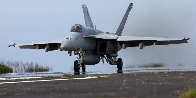 IWOJIMA, TOKYO, JAPAN - MAY 14: U.S. Navy F/A-18 Super Hornet take off during the Field Carrier Landing Practice of the Carrier Air Wing 5 of U.S. Naval Air Facility Atsugi on May 14, 2014 in Iwojima, Tokyo, Japan. The Iwo Jima Island is the setting of World War II Battle of Iwo Jima between the United States and Japan in 1945. Civilian access to the island is restricted to memorial attendees, workers for the naval air base, and meteorological agency officials. (Photo by Ken Ishii/Getty Images)