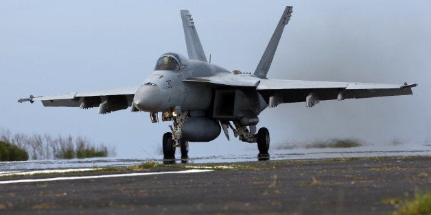 IWOJIMA, TOKYO, JAPAN - MAY 14: U.S. Navy F/A-18 Super Hornet take offduring the Field Carrier Landing Practice of the Carrier Air Wing 5 of U.S. Naval Air Facility Atsugi on May 14, 2014 in Iwojima, Tokyo, Japan. The Iwo Jima Island is the setting of World War II Battle of Iwo Jima between the United States and Japan in 1945. Civilian access to the island is restricted to memorial attendees, workers for the naval air base, and meteorological agency officials. (Photo by Ken Ishii/Getty Images)