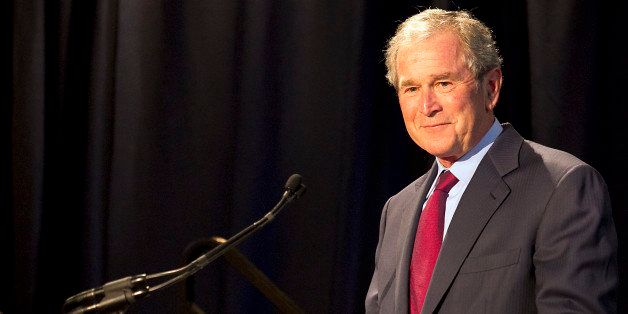 AUSTIN, TX - APRIL 10: Former President George W. Bush addresses a private gathering in the LBJ Library Atrium on April 10, 2014 in Austin, Texas. The summit is marking the 50th anniversary of the passing of the Civil Rights Act legislation, with U.S. President Barack Obama making the keynote speech on April 10. (Photo by Ralph Barrera-Pool/Getty Images)