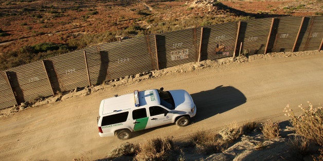 CAMPO, CA - JULY 30: US Border Patrol agents carry out special operations near the US-Mexico border fence following the first fatal shooting of a US Border Patrol agent in more than a decade on July 30, 2009 near the rural town of Campo, some 60 miles east of San Diego, California. 30-year-old agent Robert Rosas was killed on July 23 when he tracked a suspicious group of people alone in remote brushy hills north of the border in this region. Violence has been escalating in Mexico with fights between well-armed drug cartels and the army becoming common since Mexican President Felipe Calderon began his army-backed war on the cartels. Since the conflict began in late 2006, 12,800 people have been killed. Mexican officials charge that guns which are easily smuggled in from the US have flooded into Mexico where gun laws are strict. (Photo by David McNew/Getty Images)