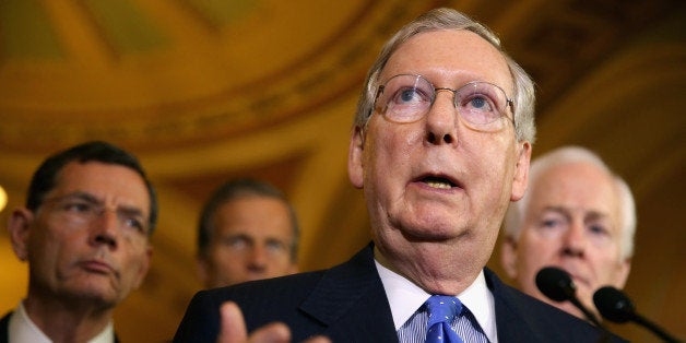 WASHINGTON, DC - JUNE 17: Senate Minority Leader Mitch McConnell (R-KY) talks to reporters after the Senate Republican policy luncheon at the U.S. Capitol June 17, 2014 in Washington, DC. McConnell and fellow Republican leaders were critical of President Barack Obama's handling of many issues, including the Keystone XL pipeline project, the insurgency in Iraq and the capture of one of the suspects in the 2011 Benghazi, Libya, attack that left four Americans dead. (Photo by Chip Somodevilla/Getty Images)