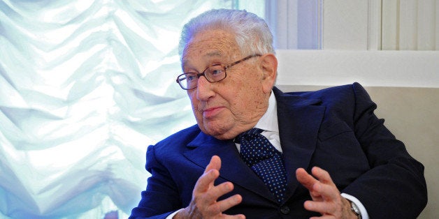Former US Secretary of State Henry Kissinger speaks with the Kremlin chief of staff during a work meeting at the Kremlin in Moscow on October 26, 2013. AFP PHOTO / RIA-NOVOSTI / POOL / MICHAEL KLIMENTYEV (Photo credit should read Michael Klimentyev/AFP/Getty Images)