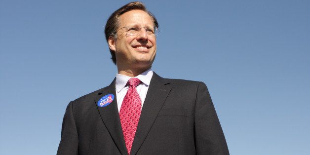 GLEN ALLEN, VA - APRIL 26: College economics professor and Republican candidate for Congress David Brat (C) poses for a photograph after attending the Henrico County Republican Party breakfast meeting April 26, 2014 in Glen Allen, Virginia. Brat went on to a surprise defeat of incumbent House Majority Leader Eric Cantor in the June 10 primary. (Photo by Jay Paul/Getty Images)