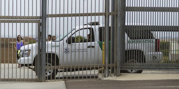 TO GO WITH AFP STORY BY YEMELI ORTEGAA truck of the US Border Patrol guards the fence that divides Mexico and the United States at the beach, Mexico on June 10, 2014. Every day, an average of 164 Mexicans who sought to settle in the United States are repatriated by Tijuana, a vibrant city in the Northwest of Mexico. Most of the 95,600 Mexicans repatriated in 2013 from the United States reentered through Tijuana. AFP PHOTO/OMAR TORRES (Photo credit should read OMAR TORRES/AFP/Getty Images)