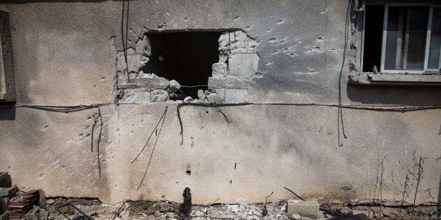 SDEROT, ISRAEL - JULY 21: A hole, allegedly caused by a Hamas rocket, is seen in an Israeli home on July 21, 2014 in Sderot, Israel. Yesterday marked the bloodiest day of the operation 'Protective Edge' yet, as 13 Israeli soldiers died and the death toll in Gaza passed 500 people. (Photo by Andrew Burton/Getty Images)