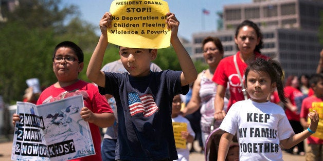 WASHINGTON, DC - JULY 07: Young children join immigration reform protesters while marching in front of the White House July 7, 2014 in Washington, DC. During the rally participants condemned 'the President's response to the crisis of unaccompanied children and families fleeing violence and to demand administrative relief for all undocumented families'. (Photo by Win McNamee/Getty Images)