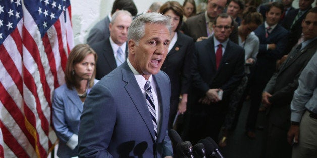 WASHINGTON, DC - JULY 09: House majority leader-elect Rep. Kevin McCarthy (R-CA) (C) talks with reporters after the weekly H