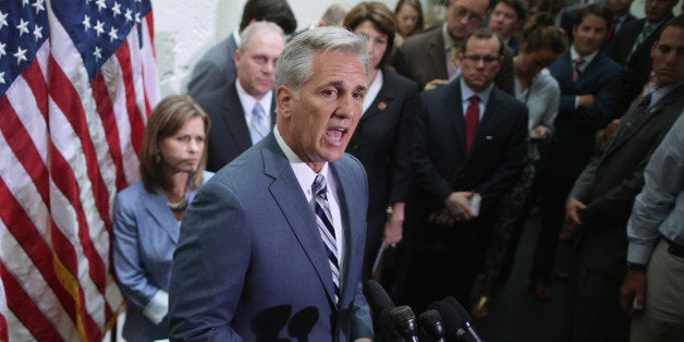 WASHINGTON, DC - JULY 09: House majority leader-elect Rep. Kevin McCarthy (R-CA) (C) talks with reporters after the weekly House Republican caucus meeting at the U.S. Capitol July 9, 2014 in Washington, DC. The House GOP leadership blamed Senate Democrats for holding up legislation that would create more full-time jobs, they said. (Photo by Chip Somodevilla/Getty Images)