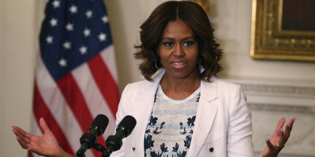 WASHINGTON, DC - JULY 22: First lady Michelle Obama speaks about drinking more water during an event in the State Dining Room of the White House July 22, 2014 in Washington, DC. First Lady Obama joined Healthier America to announce the 'Drink Up' effort to encourage everyone to drink more water to stay healthy. (Photo by Mark Wilson/Getty Images)