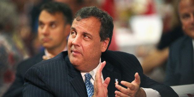 DAVENPORT, IA - JULY 17: New Jersey Gov. Chris Christie listens to speakers at 'An Evening at the Fair' event with Scott County Republicans in the Starlight Ballroom at The Mississippi Valley Fairgrounds on July 17, 2014 in Davenport, Iowa. In addition to the event at the fairgrounds, Christie attended two fundraisers for Iowa Gov. Terry Branstad and Lt. Gov. Kim Reynolds and greeted patrons with them at MJ's Restaurant in Marion, Iowa. With this four-city Iowa tour many suggest Christie may be testing his support in the state with hopes of a 2016 Republican presidential nomination. (Photo by Scott Olson/Getty Images)