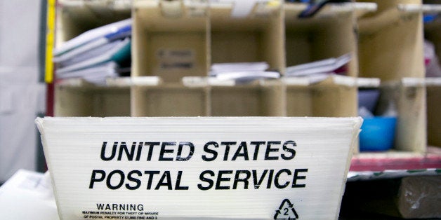A U.S. Postal Service (USPS) tray sits at the Brookland Post Office in Washington, D.C., U.S., on Thursday, May 9, 2013. The USPS is projecting a loss of as much as a $6 billion for the year as it keeps pressure on Congress for help, Postmaster General Patrick Donahoe said this month. The service is scheduled to release second-quarter results May 10. Photographer: Andrew Harrer/Bloomberg via Getty Images