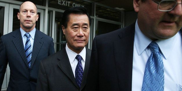 SAN FRANCISCO, CA - MARCH 31: California State Sen. Leland Yee (C) leaves the Phillip Burton Federal Building with his attorneys after a court appearance on March 31, 2014 in San Francisco, California. Yee appeared in federal court today for a second time after being arrested along with 25 others by F.B.I. agents last week on political corruption and firearms trafficking charges. Yee is free on a $500,000 unsecured bond. (Photo by Justin Sullivan/Getty Images)