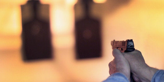 POSEN, IL - FEBRUARY 14: A marksman sights in on a target during a class he was taking to qualify for an Illinois concealed