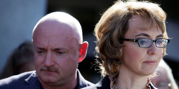 TUCSON, AZ - MARCH 06: Former U.S. Rep. Gabby Giffords and her husband Mark Kelly attend a news conference outside Safeway grocery store where they asked Congress to provide stricter gun control in the United States on March 6, 2013 in Tucson, Arizona. Giffords and Kelly were joined by survivors of the Tucson shooting that took place there two years ago when six people were killed and Giffords herself was shot in the head. (Photo by Joshua Lott/Getty Images)