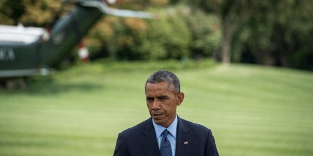 US President Barack Obama makes a statement on the situation in Ukraine on the South Lawn of the White House in Washington on July 29, 2014. AFP PHOTO/Nicholas KAMM (Photo credit should read NICHOLAS KAMM/AFP/Getty Images)