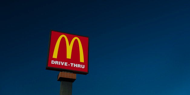 McDonald's Corp. signage stands outside of a restaurant in San Pablo, California, U.S., on Wednesday, Jan. 22, 2014. McDonald's Corp., the worlds largest restaurant chain, posted fourth-quarter profit that was little changed from a year earlier as U.S. same-store sales fell amid shaky consumer confidence and increased competition. Photographer: David Paul Morris/Bloomberg via Getty Images