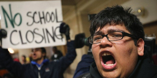 CHICAGO, IL - MARCH 25: Alan Mares and other students demonstrate outside the office of Chicago Mayor Rahm Emanuel protesting the city's plan to close more than 50 elementary schools on March 25, 2013 in Chicago, Illinois. Last week the city announced the plan claiming it was necessary to rein in a looming $1 billion budget deficit. The closings would shift about 30,000 students to new schools and leave more than 1,000 teachers with uncertain futures. (Photo by Scott Olson/Getty Images)