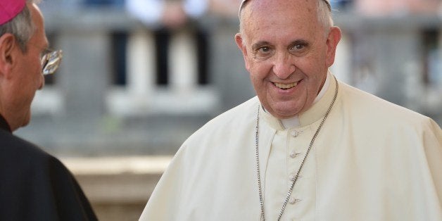 Pope Francis greets looks on as he arrives in Isernia, southern Italy, on July 5, 2014 during a one day visit in the Molise region. AFP PHOTO / ALBERTO PIZZOLI (Photo credit should read ALBERTO PIZZOLI/AFP/Getty Images)