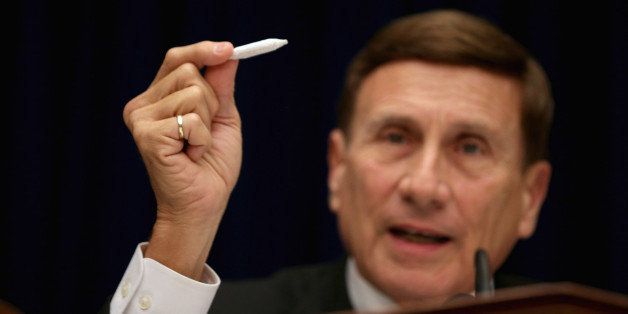 WASHINGTON, DC - MAY 09: House Oversight and Government Reform Subcommittee on Government Operations Chairman John Mica (R-FL) holds a fake hand-rolled cigarette during a hearing about marijuana laws in the Rayburn House Office Building May 9, 2014 in Washington, DC. Mica said the 'joint' was rolled by members of his staff, who he said had more experience in the task. Witnesses testified about the federal government's enforcement of marijuana laws in the face of the district's efforts to decriminalize possession of the drug. (Photo by Chip Somodevilla/Getty Images)