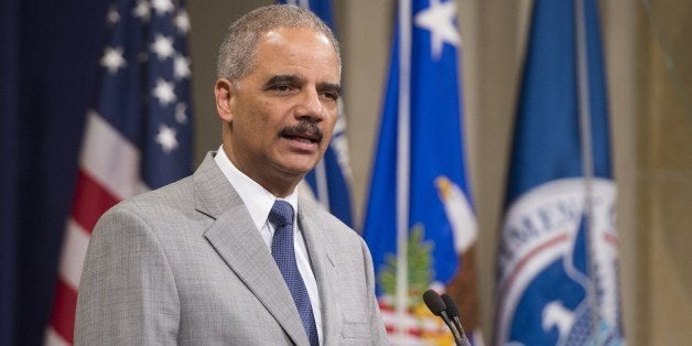 US Attorney General Eric Holder speaks during a Naturalization Ceremony at the Justice Department in Washington, DC, July 22,