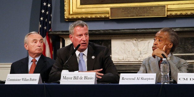 NEW YORK, NY - JULY 31: New York Mayor Bill de Blasio is joined by the Rev. Al Sharpton (right) and Police Commissioner Bill Bratton at City Hall for a roundtable discussion on police-community relations following the death of Eric Garner while in police custody in Staten Island on July 31, 2014 in New York City. The meeting included clergy members and community leaders from Staten Island and other boroughs of the city. De Blasio was elected in part as a liberal critic of the previous administration's police tactics. (Photo by Spencer Platt/Getty Images)