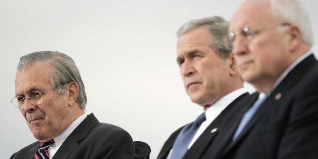 Arlington, UNITED STATES: Outgoing Secretary of Defense Donald Rumsfeld (L) is joined by US President George W. Bush (C) and Vice President Dick Cheney (R) during an Armed Forces Full Honor Review in Honor of the Secretary of Defense 15 December, 2006 at the Pentagon in Arlington, Virginia. AFP PHOTO / TIM SLOAN (Photo credit should read TIM SLOAN/AFP/Getty Images)