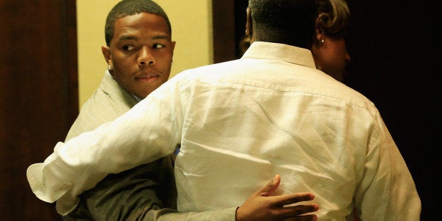 OWINGS MILLS, MD - MAY 23: Running back Ray Rice of the Baltimore Ravens gets a hug from his wife Janay and father in law Joe Palmer following a news conference at the Ravens training center on May 23, 2014 in Owings Mills, Maryland. Rice spoke publicly for the first time since facing felony assault charges stemming from a February incident involving Janay at an Atlantic City casino. (Photo by Rob Carr/Getty Images)