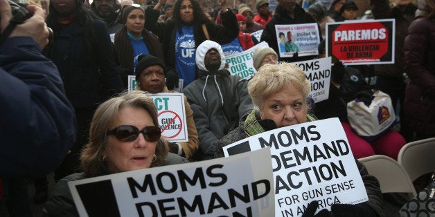 NEW YORK, NY - MARCH 21: Demonstrators take part in a rally against gun violence on March 21, 2013 in the Harlem neighborhood of the Manhattan borough of New York City. The group Moms Demand Action for Gun Sense In America as well as gun violence victims, youth organizations, healthcare workers, unions, elected officials, faith leaders and artists demonstrated to promote New York Gov. Andrew Cuomo's NY SAFE Act as a national model for federal gun control legislation. (Photo by John Moore/Getty Images)