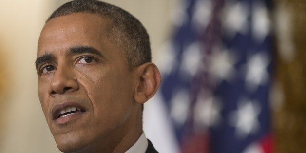 US President Barack Obama speaks about the situation in Iraq in the State Dining Room at the White House in Washington, DC, August 7, 2014. Obama said he authorized air strikes and relief supply drops in Iraq to prevent 'genocide' by Islamist extremists against minorities. 'We can act, carefully and responsibly, to prevent a potential act of genocide,' Obama said, in an address as he announced military action. AFP PHOTO / Saul LOEB (Photo credit should read SAUL LOEB/AFP/Getty Images)