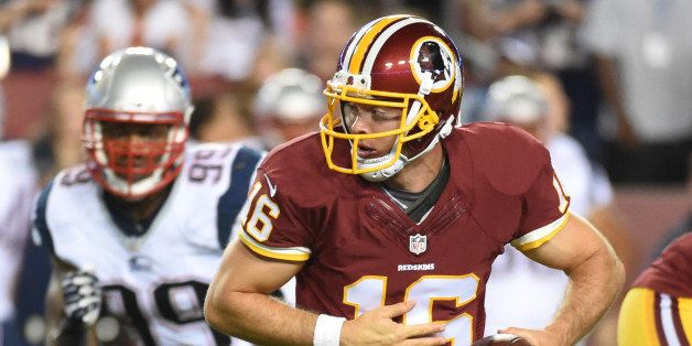 WASHINGTON - AUGUST 7:Washington Redskins quarterback Colt McCoy (16) rolls out of the pocket before handing off the ball during the game between the Washington Redskins and the New England Patriots at FedEx Field on Thursday, August 7, 2014. (Photo by Jonathan Newton/The Washington Post via Getty Images)