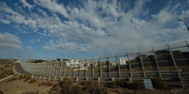 View of the Mexican town of Tijuana from the US side of the border and showing the fence that divides the two countries in San Diego on August 20, 2014. At least 57,000 unaccompanied children, most from Honduras, Guatemala and El Salvador, have crossed the border into the United States illegally since October, triggering a migration crisis that has sent US border and immigration authorities into a frenzy. AFP PHOTO/Mark RALSTON (Photo credit should read MARK RALSTON/AFP/Getty Images)