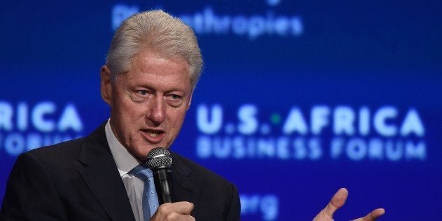 Former US President Bill Clinton moderates a panel discussion during US-Africa Business Forum on the sideline of the US-Africa Leaders Summit in Washington, DC, on August 5, 2014. US companies are planning $14 billion worth of investments in Africa, a White House official said Tuesday as Washington seeks to strengthen commercial ties during the historic US-Africa Leaders Summit. With the United States seeking to counter the Chinese and European trade dominance in Africa, a White House official said the investments will span a range of industries, including construction, clean energy, banking, information technology, and others. (Photo credit should read JEWEL SAMAD/AFP/Getty Images)