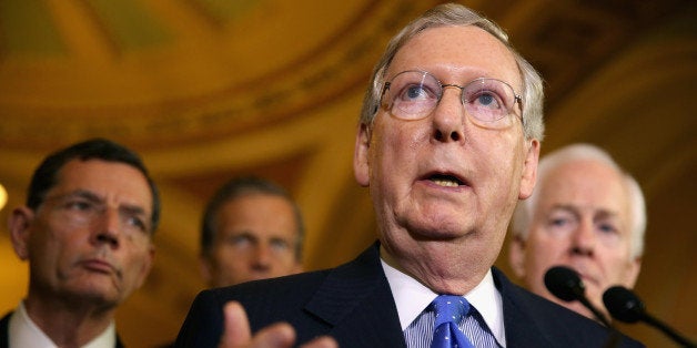 WASHINGTON, DC - JUNE 17: Senate Minority Leader Mitch McConnell (R-KY) talks to reporters after the Senate Republican policy luncheon at the U.S. Capitol June 17, 2014 in Washington, DC. McConnell and fellow Republican leaders were critical of President Barack Obama's handling of many issues, including the Keystone XL pipeline project, the insurgency in Iraq and the capture of one of the suspects in the 2011 Benghazi, Libya, attack that left four Americans dead. (Photo by Chip Somodevilla/Getty Images)