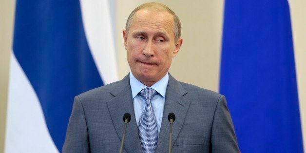 Russian President Vladimir Putin speaks during his and Finnish President Sauli Niinisto's news conference after talks at a re