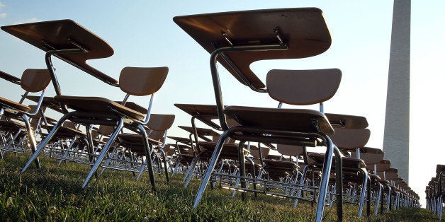 WASHINGTON, DC - JUNE 20: An installation of 857 empty school desks, representing the number of students nationwide who are dropping out every hour of every school day, is on display at the National Mall June 20, 2012 in Washington, DC. The installation was presented by not-for-profit organization College Board to call upon presidential candidates who are running for the White House to make education a more prominent issue in the 2012 campaigns and put the nationâs schools back on track. (Photo by Alex Wong/Getty Images)