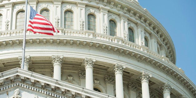 UNITED STATES - SEPTEMBER 11: A US Capitol Police sharpshooter, lower right corner, keeps watch with his binoculars during th