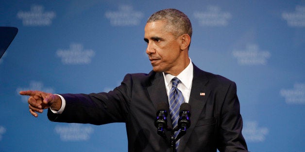 President Barack Obama points out a special guest as he speaks during the American Legion national convention in Charlotte, N.C., Tuesday, Aug. 26, 2014. Three months after a veterans' health care scandal rocked his administration, President Barack Obama is taking executive action to improve the mental well-being of veterans. The president was to announce his initiatives during an appearance before the American Legion National Convention that is fraught with midterm politics. (AP Photo/Chuck Burton)