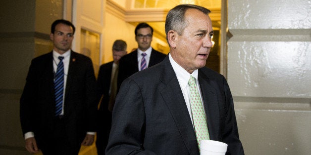 UNITED STATES - AUGUST 1: Speaker of the House John Boehner, R-Ohio, arrives for the House Republican caucus meeting to hash out an immigration bill in the Capitol on Aug. 1, 2014. (Photo By Bill Clark/CQ Roll Call)