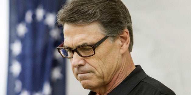 ROCHESTER, NH - AUGUST 23: Texas Gov. Rick Perry pauses during a GOP event August 23, 2014 in Rochester, New Hampshire. Perry was recently indicted on felony charges of abuse of power and coercion of a public servant. (Photo by Scott Eisen/Getty Images)