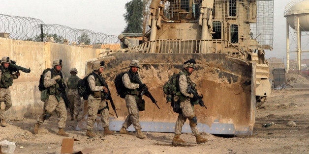 In this photo released by the US Marines, Marines of Bravo Company, 1st Battalion, 8th Marines set out on a patrol while part