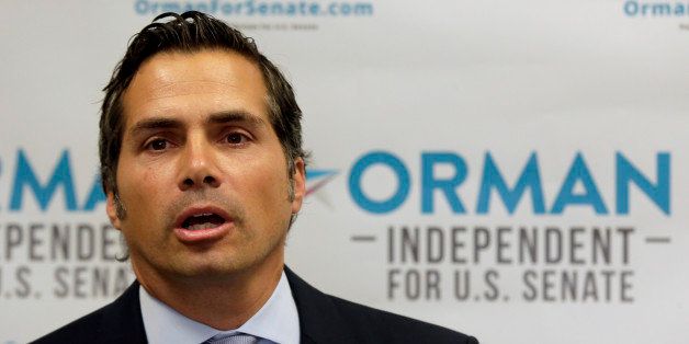 Greg Orman, an independent candidate for U.S. Senate, talks about launching his statewide television and radio ad campaign during a news conference at his campaign headquarters Thursday, July 10, 2014, in Shawnee, Kan. (AP Photo/Charlie Riedel)