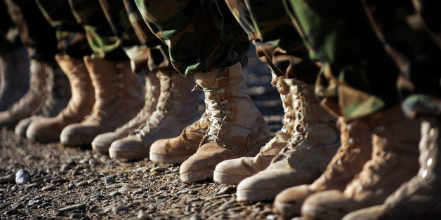 January 4, 2010 - Afghan National Army Air Corp Soldiers get ready to fill the boots of U.S. Forces troops as they prepare for M-240B machine gun familiarization training in Kandahar, Afghanistan. Airmen mentors conduct training like this to empower Afghan Soldiers to take over their own security without U.S. assistance.