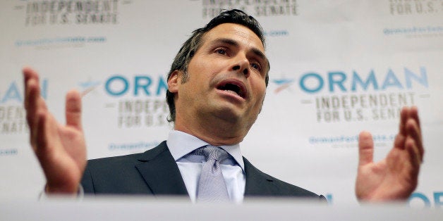 Greg Orman, an independent candidate for U.S. Senate, talks about launching his statewide television and radio ad campaign during a news conference at his campaign headquarters Thursday, July 10, 2014, in Shawnee, Kan. (AP Photo/Charlie Riedel)