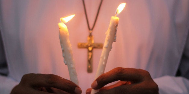 LAHORE, PUNJAB, PAKISTAN - 2014/08/17: Pakistani Christian community light candles in the memory of Christians killed in Iraq, during a candlelight vigil to pay tribute to the Martyr's of Palestine at Lahore,Pakistan. (Photo by Rana Sajid Hussain/Pacific Press/LightRocket via Getty Images)