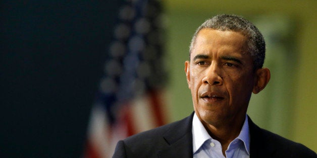 President Barack Obama approaches a podium in Edgartown, Mass., Wednesday, Aug. 20, 2014, to address members of the media about the killing of American journalist James Foley by militants with the Islamic State extremist group. The president said the US will continue to confront Islamic State extremists despite the brutal murder of journalist James Foley. Obama said the entire world is "appalled" by Foley's killing. The president says he spoke Wednesday with Foley's family and offered condolences. (AP Photo/Steven Senne)